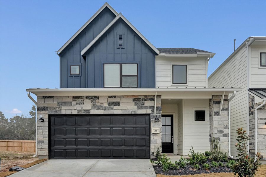 Front exterior of a new home in Summer Place  35', Montgomery, TX, highlighting curb appeal (Image 28).