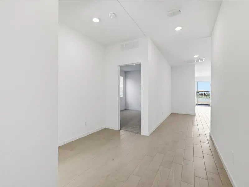 Spacious, unfurnished interior of a new home in Rancho Mirage Estate Series, Maricopa (Image 9).