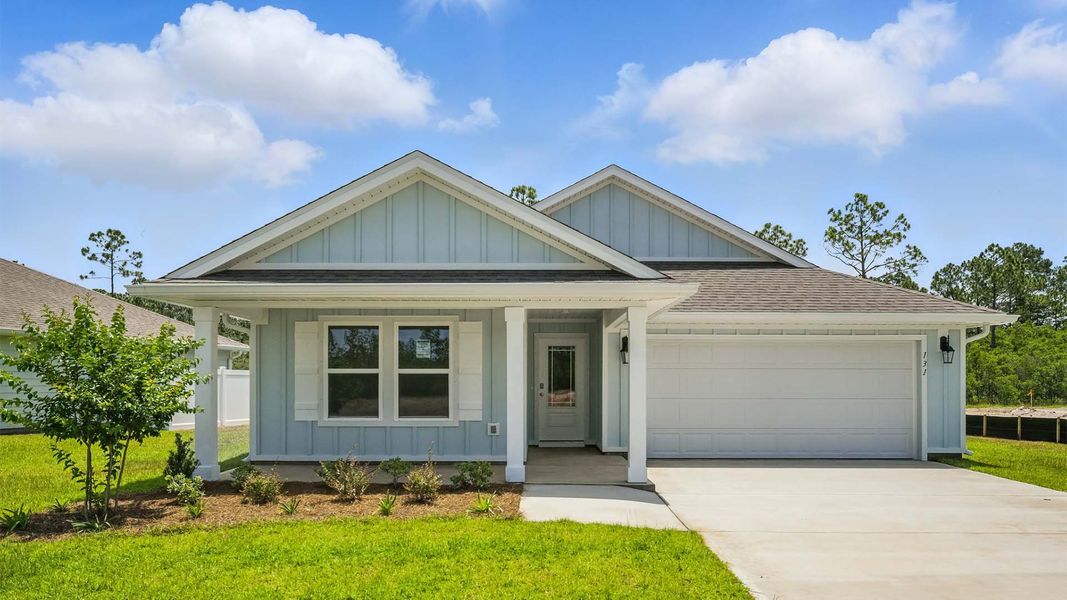Front exterior of a new home in Palmetto Bluff, Port Saint Joe, FL, highlighting curb appeal (Image 1).