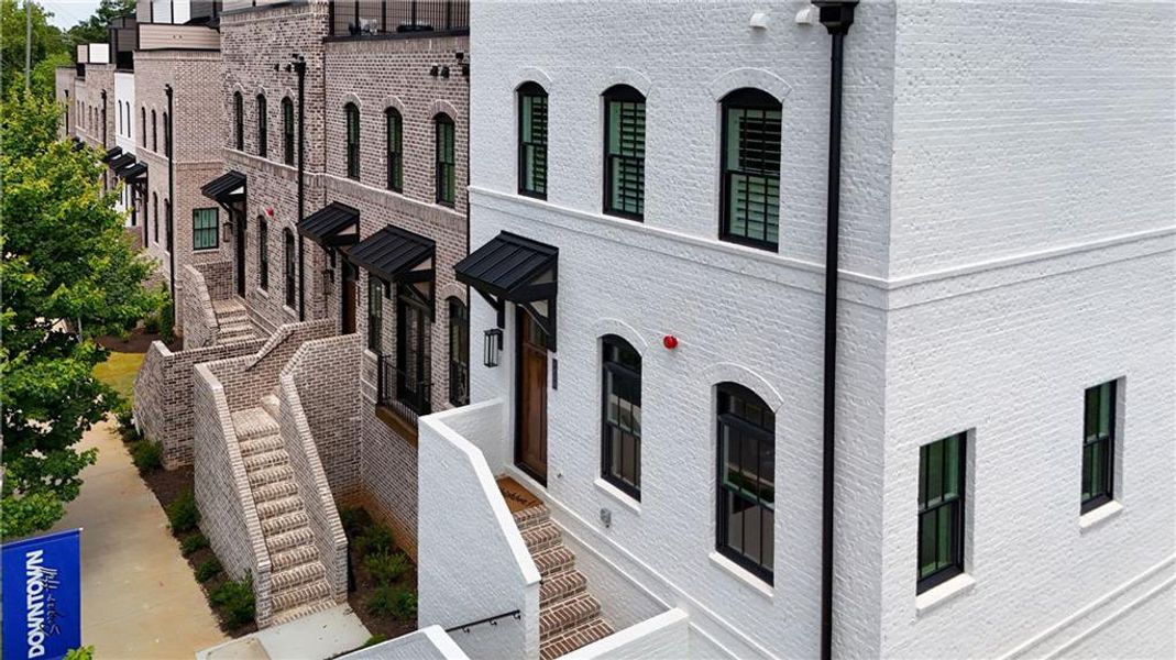 Front exterior of a new home in Skyview On Broad, Sugar Hill, GA, highlighting curb appeal (Image 2).