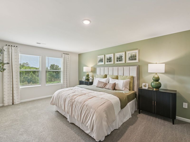 Primary bedroom in the Chatham floorplan at a Meritage Homes community in Mebane, NC. Primary bedroom in the Chatham floorplan at a Meritage Homes community in Mebane, NC.