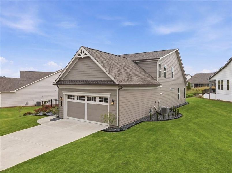 Front exterior of a new home in , Hoschton, GA, highlighting curb appeal (Image 29).