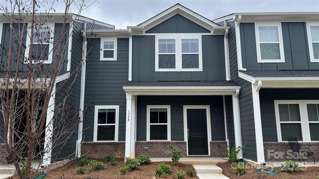 Front exterior of a new home in , Mooresville, NC, highlighting curb appeal (Image 1). Front exterior of a new home in , Mooresville, NC, highlighting curb appeal (Image 1).