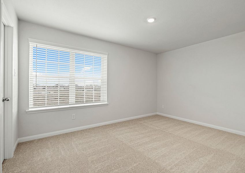 An upstairs bedroom with a walk-in closet An upstairs bedroom with a walk-in closet