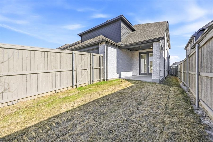 Exterior details and patio area of a home in Pecan Square, Northlake (Image 2).
