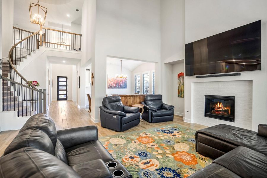 A curved staircase and open entry way add elegance and sophistication.
