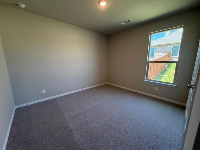 Carpeted room featuring a single window, recessed lighting, and neutral wall tones
