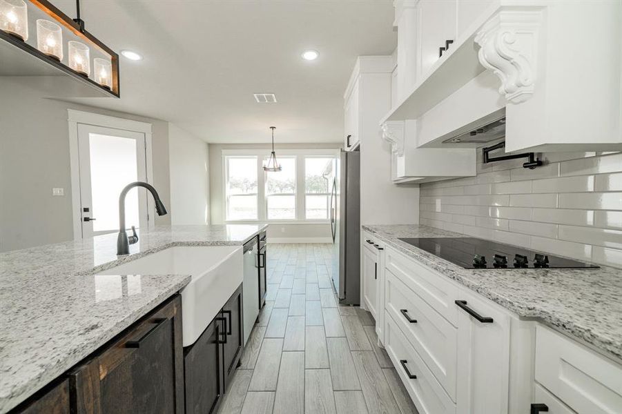 Granite Countertops, farm sink, electric stovetop, pot filler, new refrigerator (included) Granite Countertops, farm sink, electric stovetop, pot filler, new refrigerator (included)