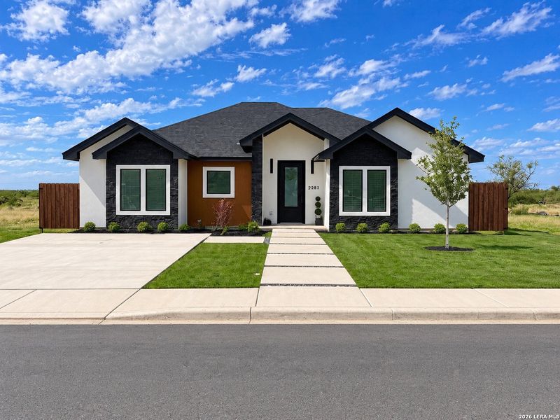 Front exterior of a new home in , Eagle Pass, TX, highlighting curb appeal (Image 25).