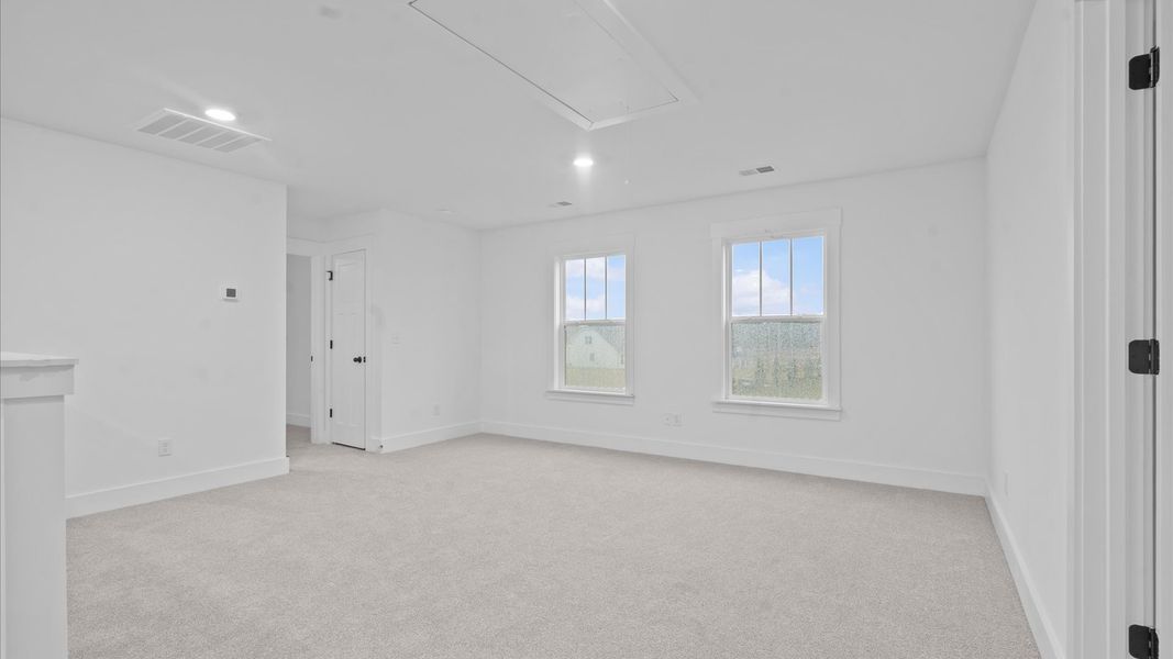 Superior loft space with soft carpet, ideal for work, relaxation, or entertainment