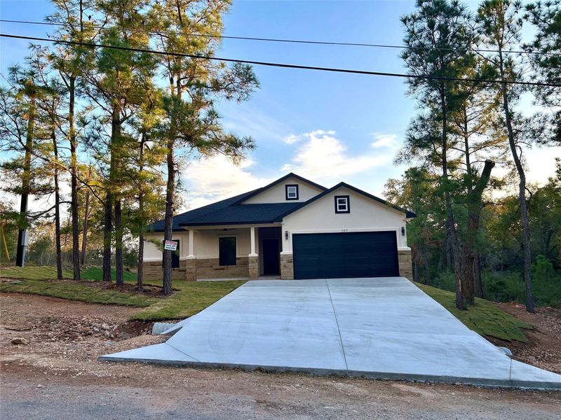 Tall pine trees adorn the house.