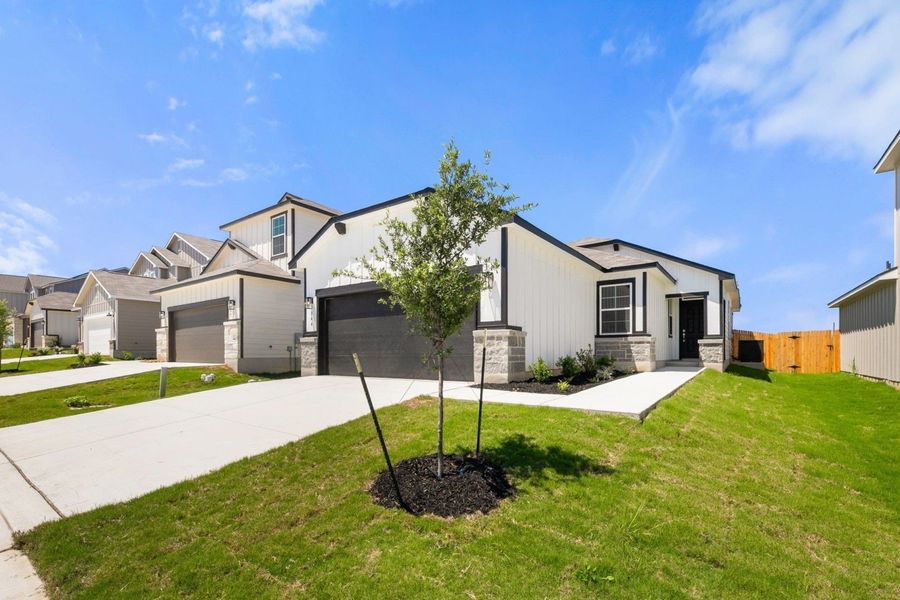 Representative exterior photo of a completed home built from the Big Bend by Hakes Brothers in Highland Ridge, New Braunfels, TX (Image 1). Representative exterior photo of a completed home built from the Big Bend by Hakes Brothers in Highland Ridge, New Braunfels, TX (Image 1).
