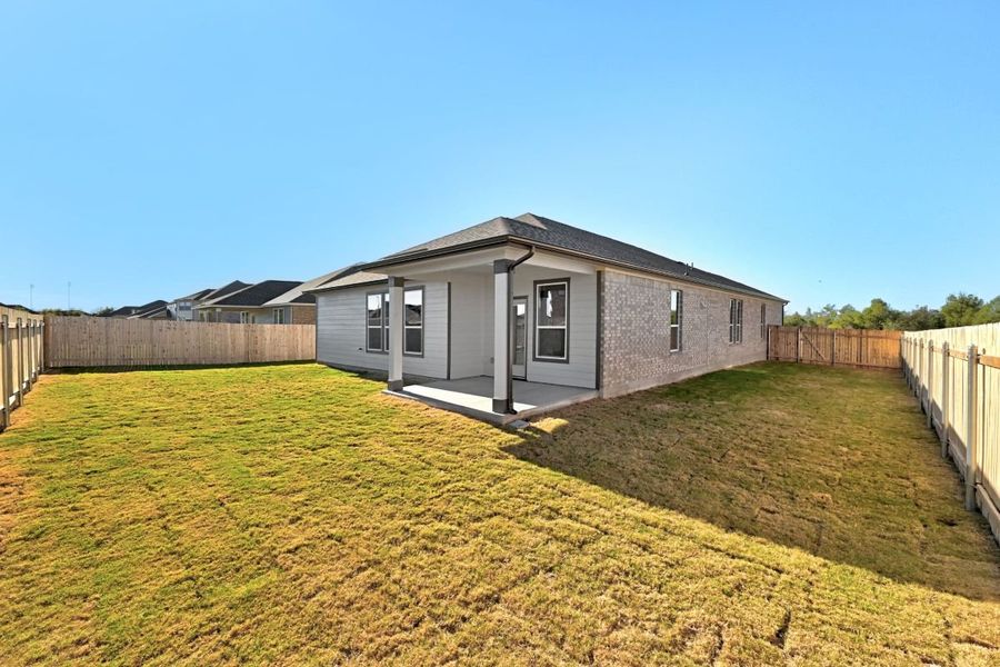 Exterior details and patio area of a home in Mustang Valley, Manor (Image 2).