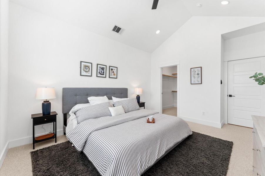 Retreat to the luxurious primary bedroom where cathedral ceilings and expansive windows create an airy, light-filled sanctuary. Wake up to tranquil courtyard views offering a daily dose of greenery and calm.