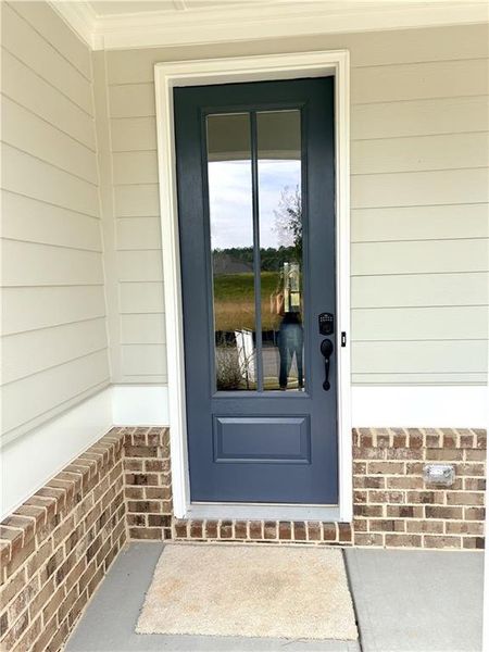 Exterior details and patio area of a home in Heritage Pointe at The Georgian, Villa Rica (Image 22).