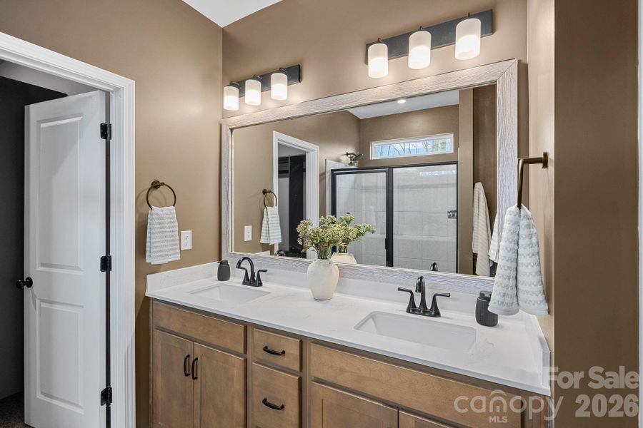 Primary bathroom offers dual sinks. Primary bathroom offers dual sinks.