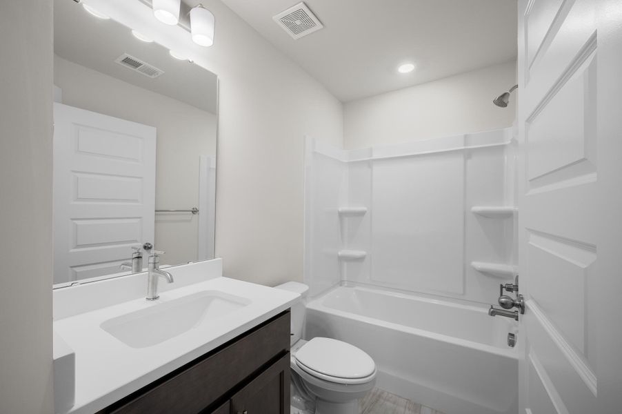 Photo is of a similar home