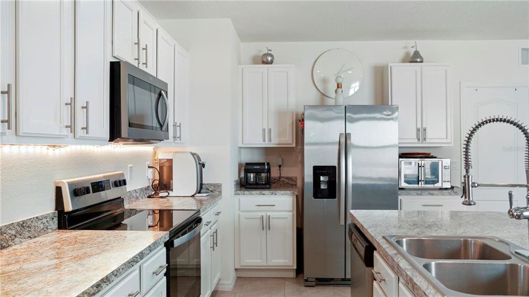 Furnished interior view inside a new home in Charles Cove Express, Davenport (Image 26).