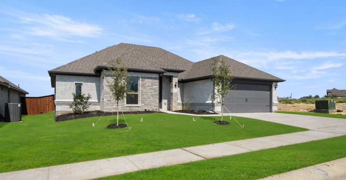Representative exterior photo of a completed home built from the Alderbury by Impression Homes in Timberbrook, Justin, TX (Image 2).