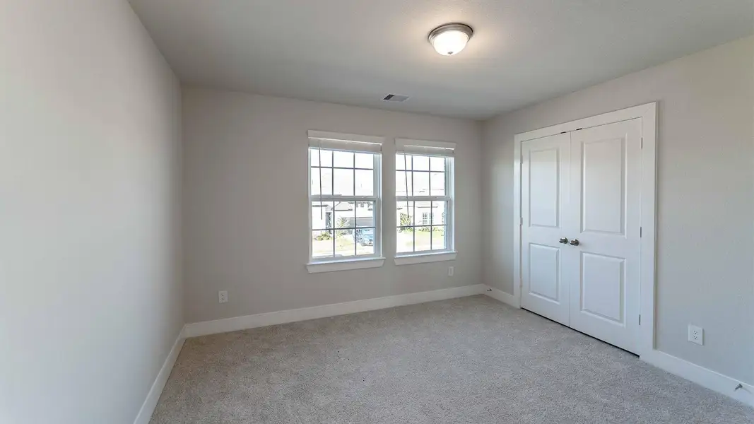 Spacious, unfurnished interior of a new home in Sunterra, Katy (Image 14).