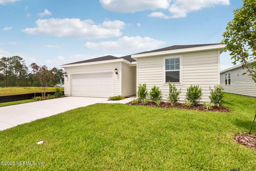 Front exterior of a new home in , Palm Coast, FL, highlighting curb appeal (Image 22).