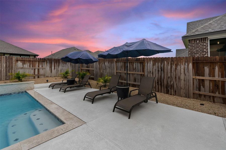 Enjoy a resort-style backyard with heated pool, covered patio, and professional landscaping. Enjoy a resort-style backyard with heated pool, covered patio, and professional landscaping.