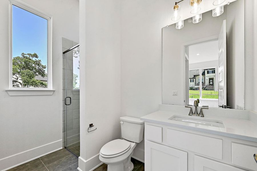 Furnished interior view inside a new home in Rough Hollow, Austin (Image 8).