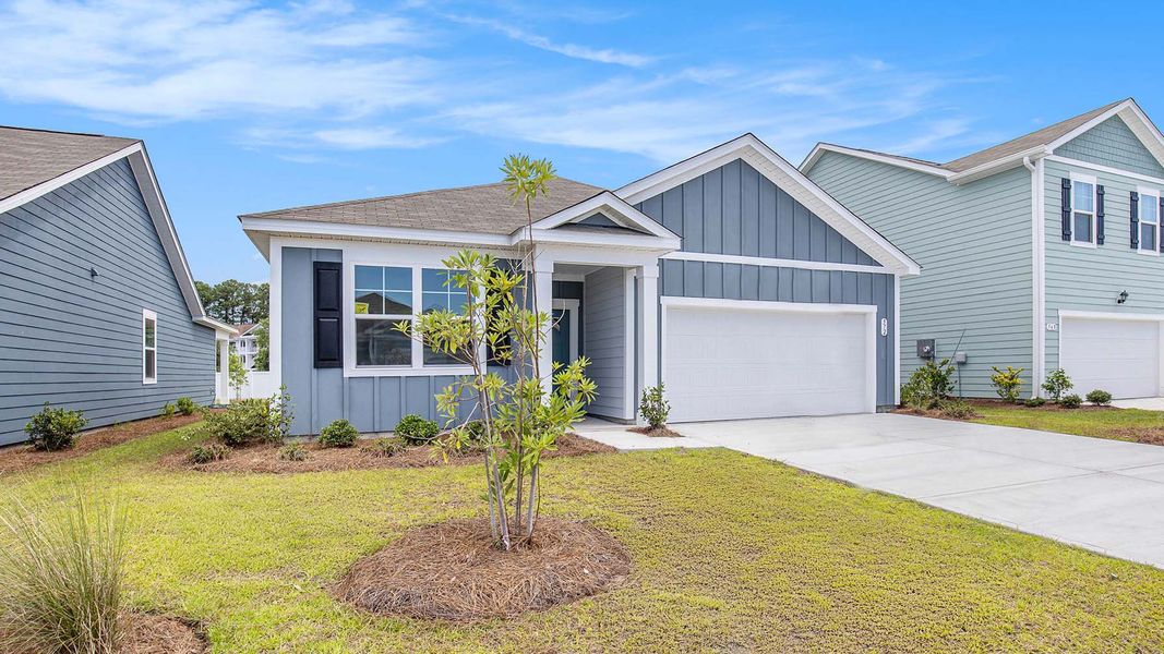 Front exterior of a new home in Auberon Woods, Conway, SC, highlighting curb appeal (Image 2).