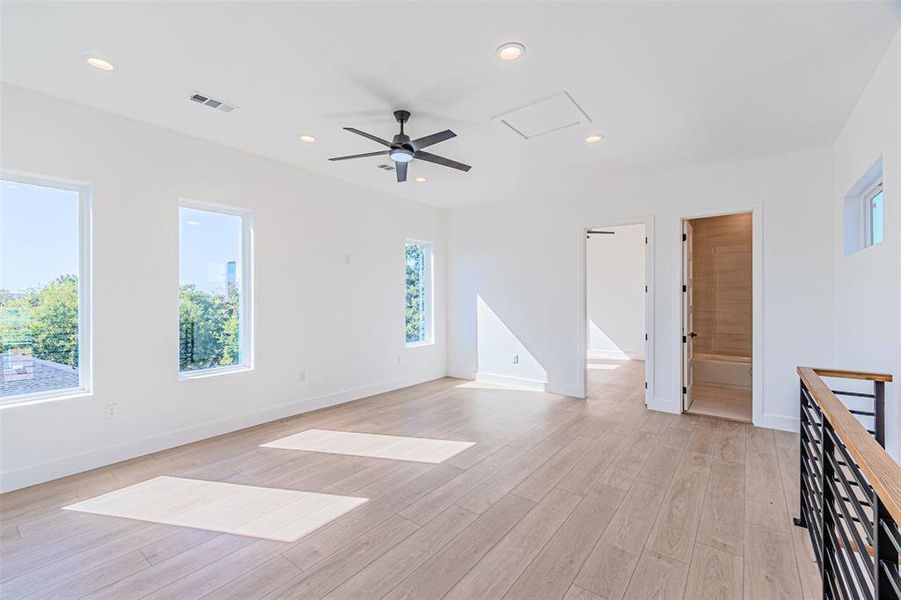 Unfurnished living room with ceiling fan, recessed lighting, and light wood-type flooring