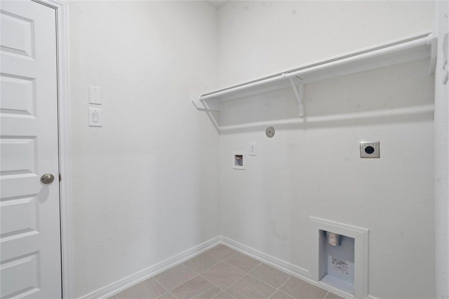 This dedicated laundry space is designed for maximum efficiency and ease of use, providing a clean, organized environment for daily household tasks. Its streamlined layout and neutral finishes make it a versatile asset that integrates seamlessly into the home’s overall design. This dedicated laundry space is designed for maximum efficiency and ease of use, providing a clean, organized environment for daily household tasks. Its streamlined layout and neutral finishes make it a versatile asset that integrates seamlessly into the home’s overall design.