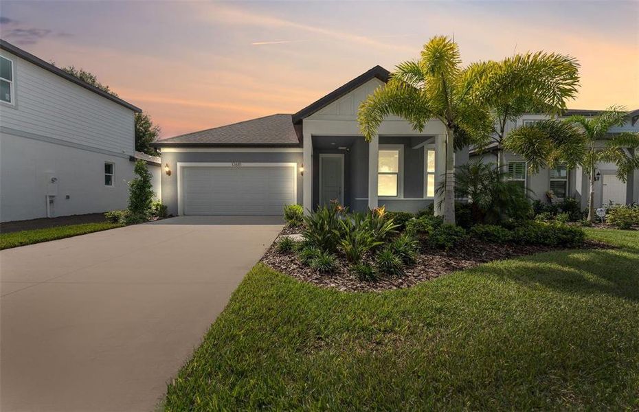 Front exterior of a new home in Riversedge, Riverview, FL, highlighting curb appeal (Image 2).