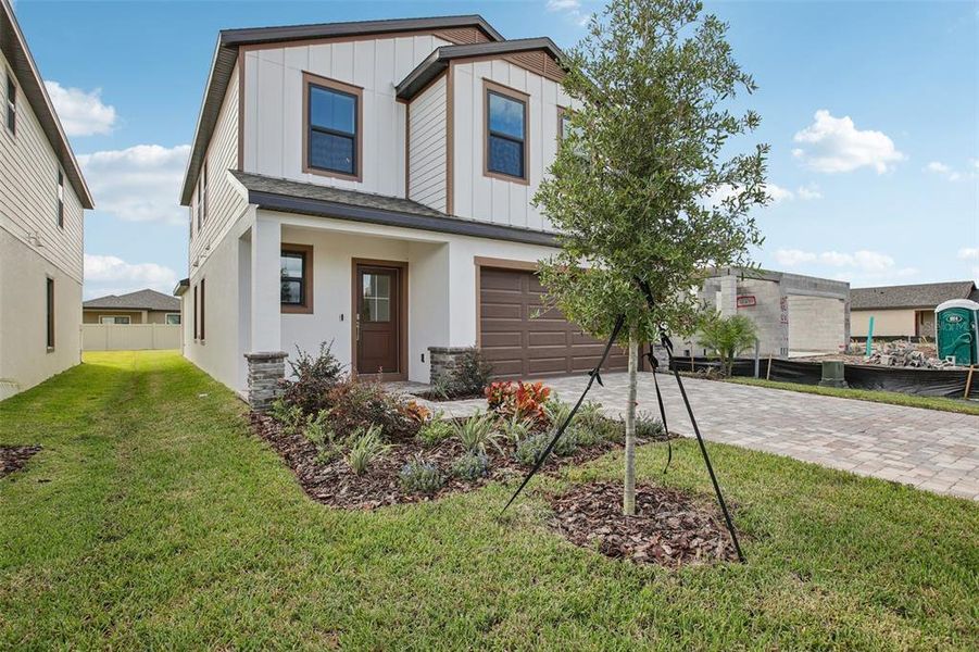 Exterior details and patio area of a home in Grasslands West, Lakeland (Image 25).