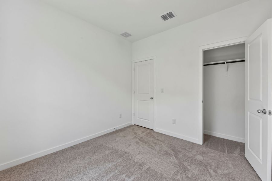 Spacious, unfurnished interior of a new home in Parkton Square, Kyle (Image 24).