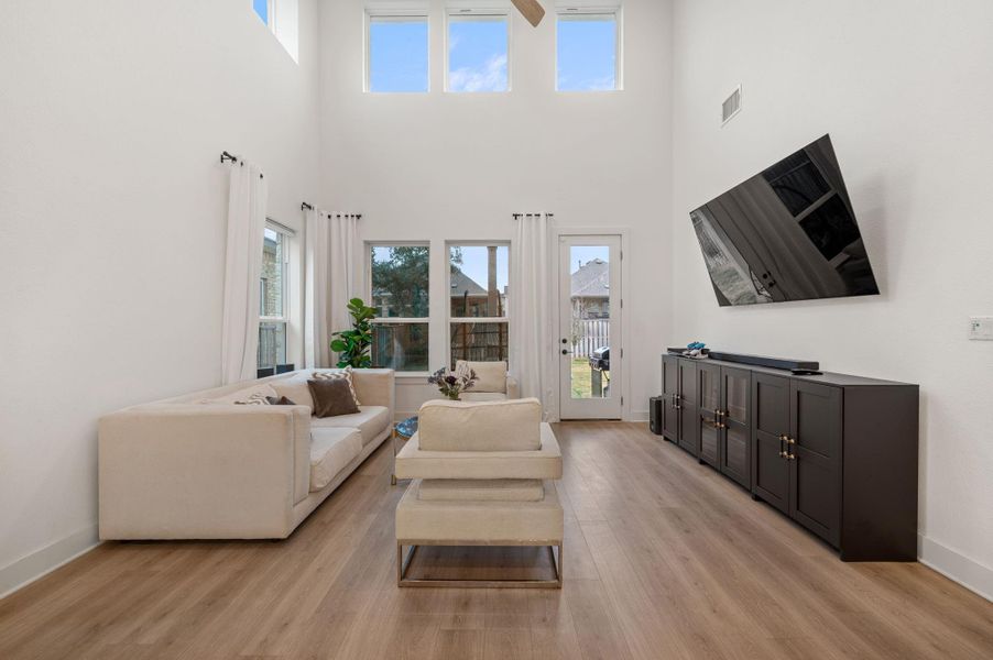 Large inviting living room with high ceilings and lots of natural light