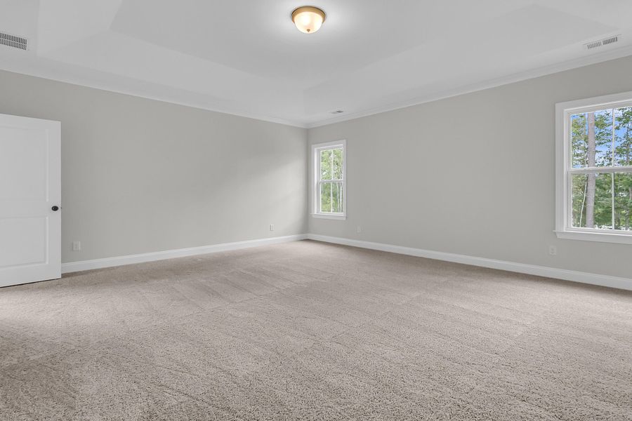 Spacious, unfurnished interior of a new home in Tidewater at Lakes of Cane Bay, Summerville (Image 51).