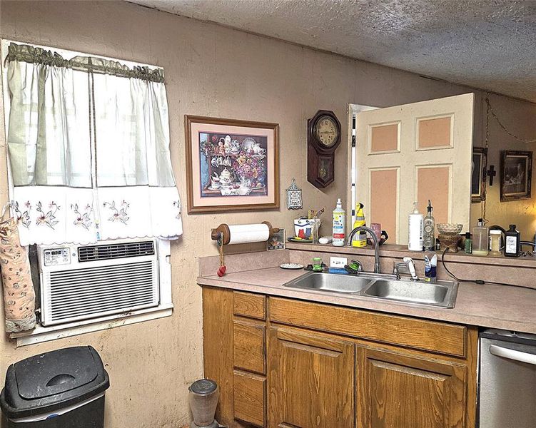 Kitchen features almost new dishwasher