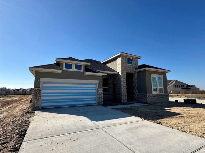 Front exterior of a new home in Briarley, Montgomery, TX, highlighting curb appeal (Image 1). Front exterior of a new home in Briarley, Montgomery, TX, highlighting curb appeal (Image 1).