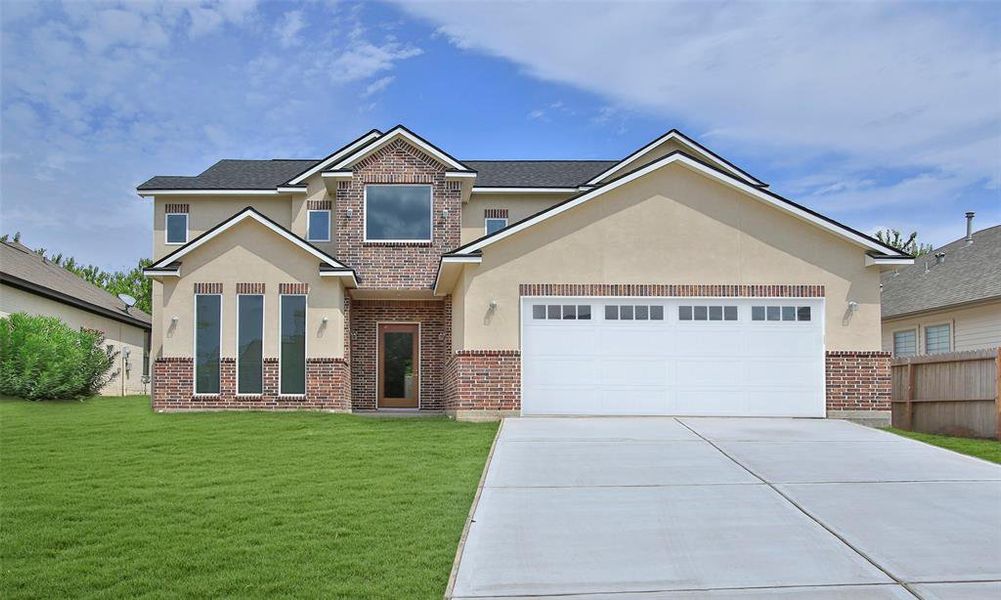 Tile flooring enhances the welcoming entryway of this home, new light fixtures will be installed. *New photos coming soon