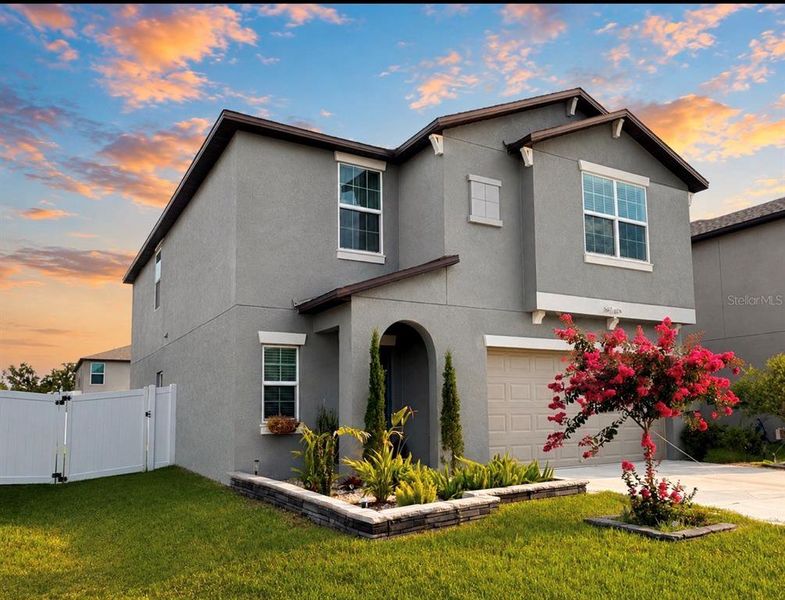 Front exterior of a new home in , Zephyrhills, FL, highlighting curb appeal (Image 2). Front exterior of a new home in , Zephyrhills, FL, highlighting curb appeal (Image 2).
