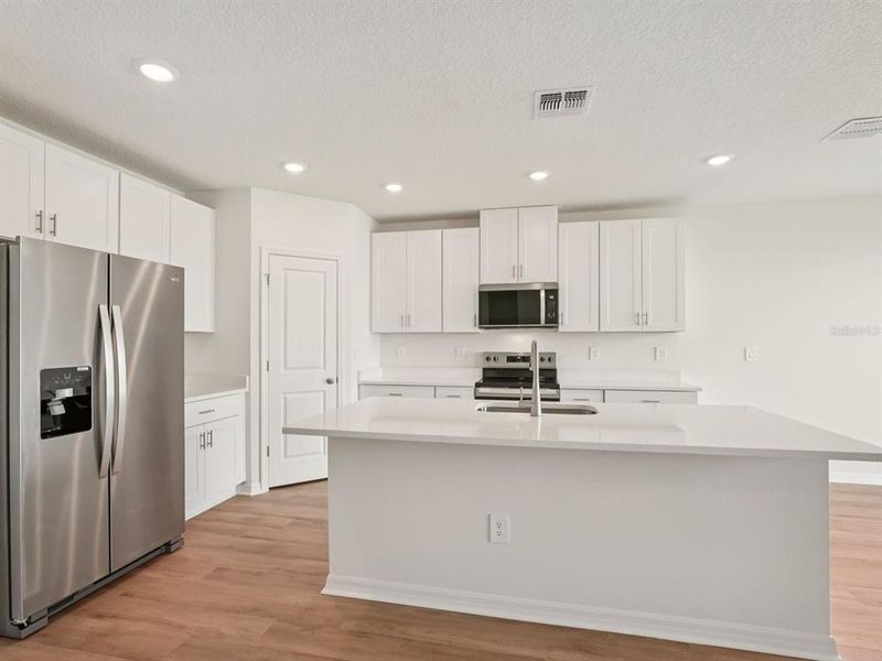 Furnished interior view inside a new home in Salt Meadows - Classic Series, Parrish (Image 4). Furnished interior view inside a new home in Salt Meadows - Classic Series, Parrish (Image 4).