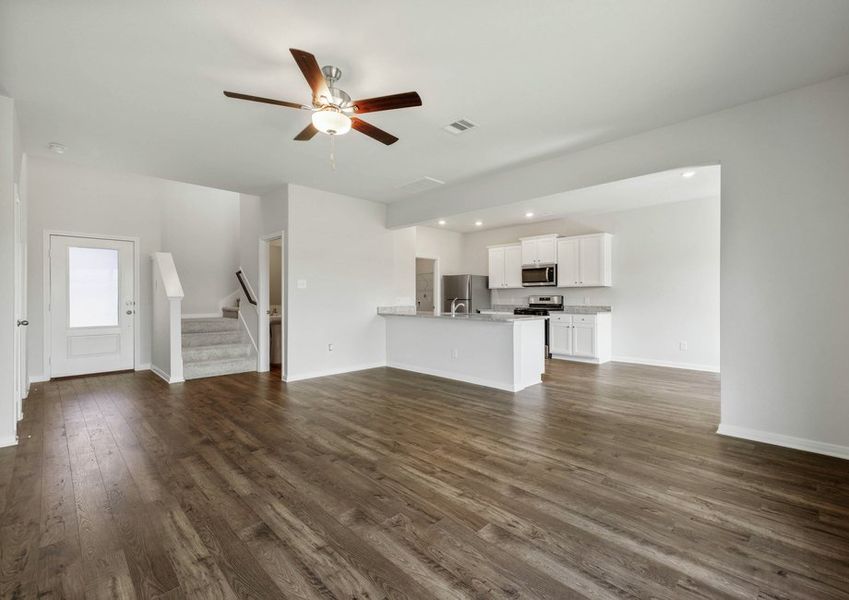 Vinyl flooring flows throughout the main living areas
