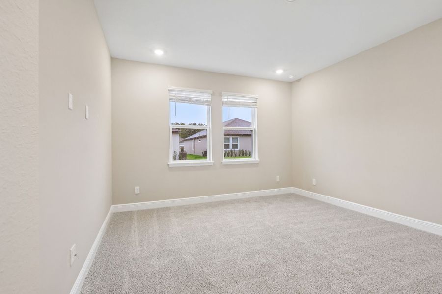 Spacious, unfurnished interior of a new home in Legends Preserve - Signature Series, Daytona Beach (Image 13).