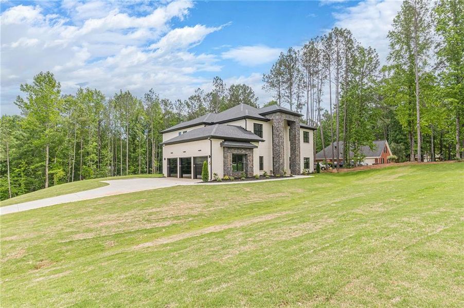 Front exterior of a new home in , McDonough, GA, highlighting curb appeal (Image 33).