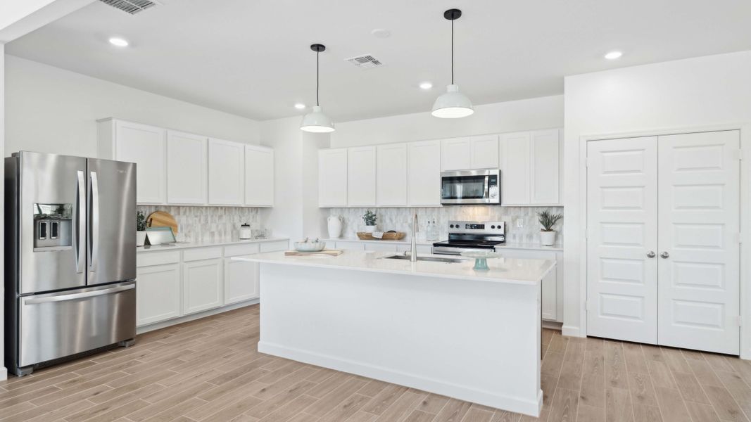 Representative furnished interior of a home built from the Stork by D.R. Horton in Apache Farms, Buckeye (Image 10).