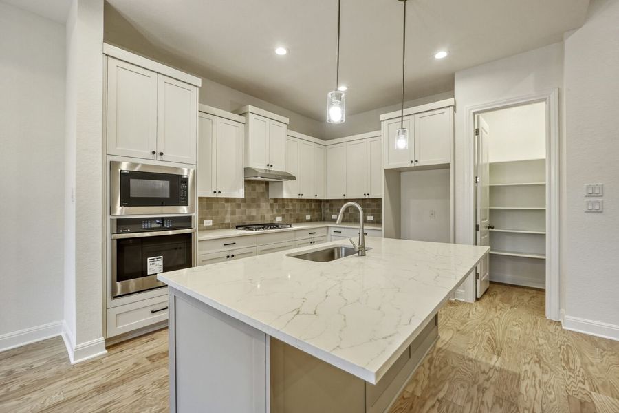 Furnished interior view inside a new home in 6 Creeks, Kyle (Image 5).