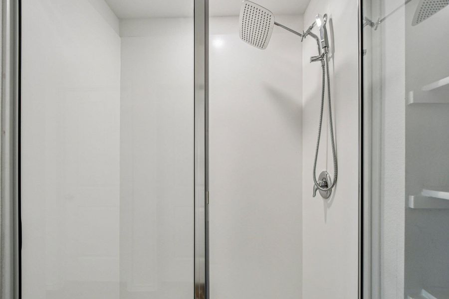 Full bathroom featuring a stall shower