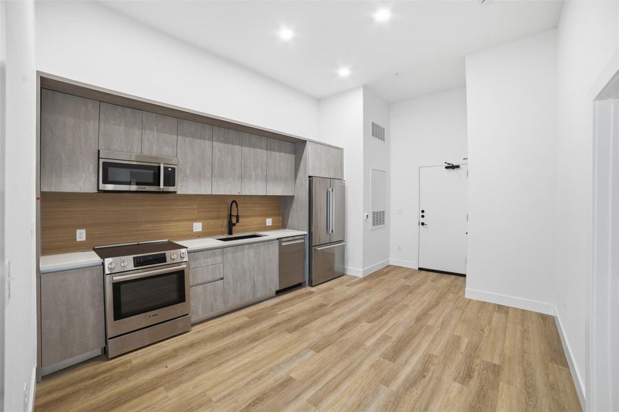 Furnished interior view inside a new home in Congress Lofts Saint Elmo, Austin (Image 4).