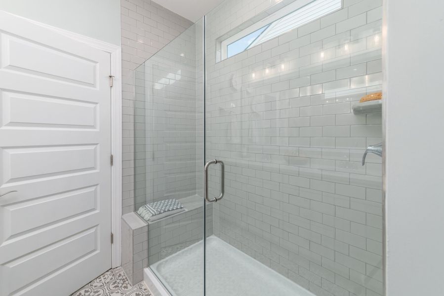 Frameless shower enclosure in owner's bath