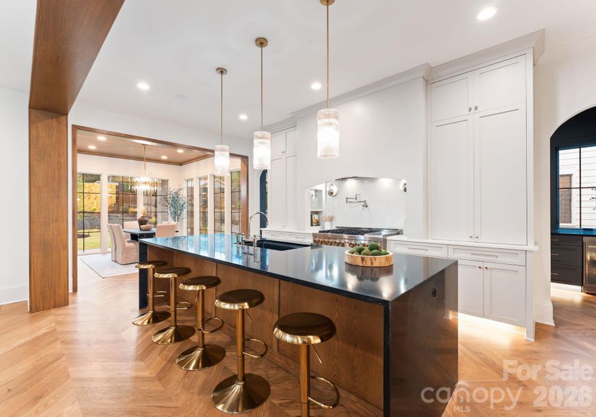waterfall island countertop and white oak wrapped cased openings