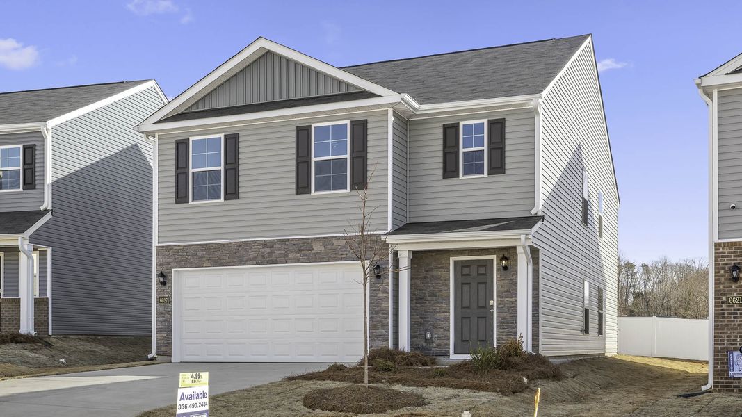 Front exterior of a new home in Willow Mill, Thomasville, NC, highlighting curb appeal (Image 16).